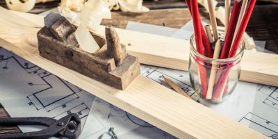 Antique carpentry workbench with tools on old wooden table